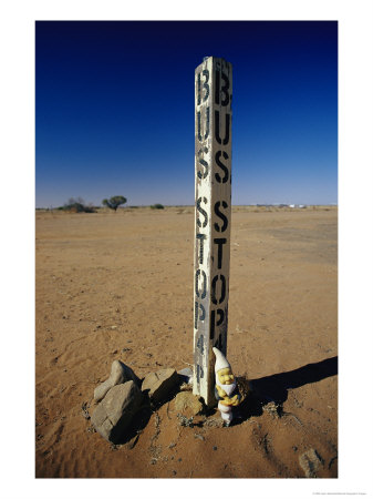 A Garden Gnome At A Bus Stop In An Outback Desert Town by Jason Edwards Pricing Limited Edition Print image