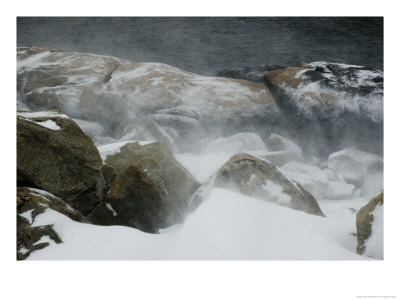 Snow Blowing Over Large Bolders On The Bank Of A River by Todd Gipstein Pricing Limited Edition Print image