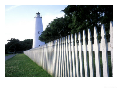 The Lighthouse Stands Behind A Fence On Ocracoke Island by Stephen Alvarez Pricing Limited Edition Print image