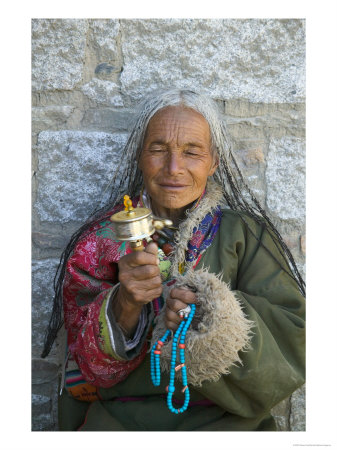 Tibetan Woman Holding Praying Wheel In Sakya Monastery, Tibet, China by Keren Su Pricing Limited Edition Print image