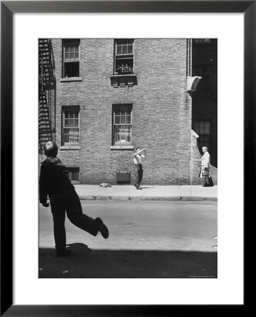 Boy Hitting Ball During Game Of Stickball by Ralph Morse Pricing Limited Edition Print image