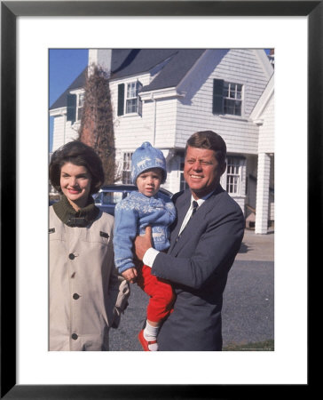 Presidential Candidate John F. Kennedy Holding Daughter With Wife Outside Home On Election Day by Paul Schutzer Pricing Limited Edition Print image