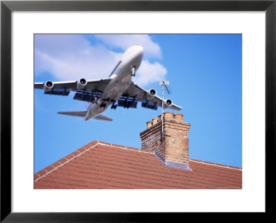 Low-Flying Aircraft Over Rooftops Near London Heathrow Airport, Greater London, England by Mark Mawson Pricing Limited Edition Print image