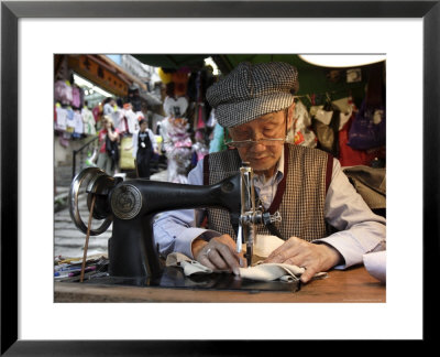 A Tailor At Work In Hong Kong, China by Andrew Mcconnell Pricing Limited Edition Print image