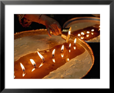 Pilgrims Pour Melting Butter From Their Lamps Into The Yak Butter Lamps In The Monastery by Don Smith Pricing Limited Edition Print image