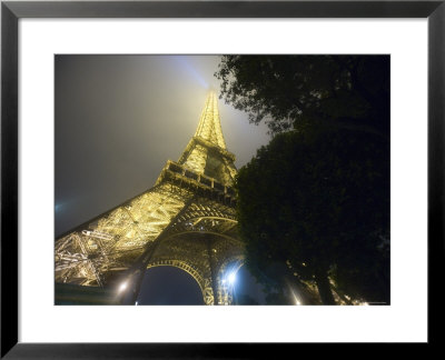 Close-Up Of Eiffel Tower Illuminated At Night, Paris, France by Jim Zuckerman Pricing Limited Edition Print image