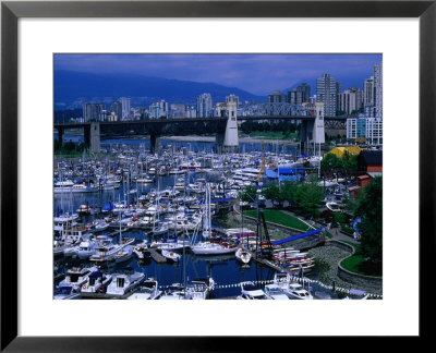 Overhead View Of The Marina At Granville Island, With City In Distance, Vancouver, Canada by Mark & Audrey Gibson Pricing Limited Edition Print image