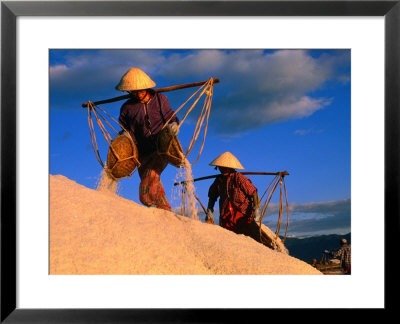 Female Labourers Carrying Sea Salt In Salt Fields Of Doc Let Beach, Khanh Hoa, Vietnam by John Banagan Pricing Limited Edition Print image