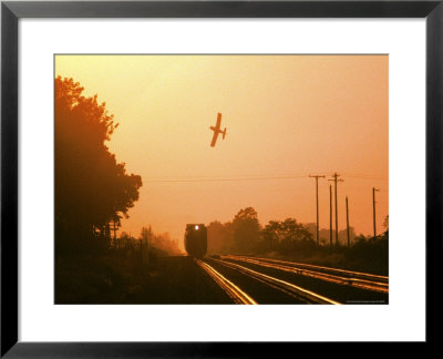 Aerial Crop Duster And Train At Sunrise by Rex Stucky Pricing Limited Edition Print image