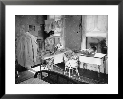 Woman Ironing In Slum Home by William C. Shrout Pricing Limited Edition Print image