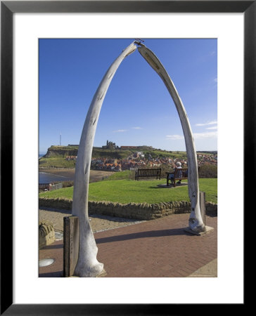 Whalebone Arch On Seafront, With Whitby Abbey Ruin In Distance, Whitby, Yorkshire by Neale Clarke Pricing Limited Edition Print image