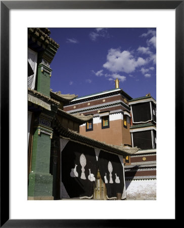 Exterior View Of Painted Monastery Buildings With Cloth Curtains, Qinghai, China by David Evans Pricing Limited Edition Print image