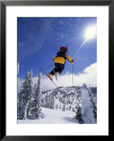 Skier In Mid Air At The Big Mountain Ski Area by Gordon Wiltsie Pricing Limited Edition Print image