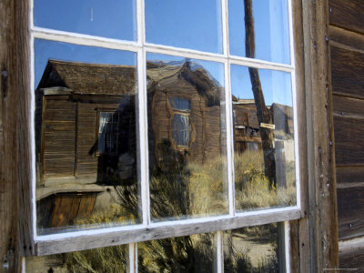 Ghost Town Building Reflected In Window Of Abandoned Structure, Bodie State Historic Park by Dennis Kirkland Pricing Limited Edition Print image