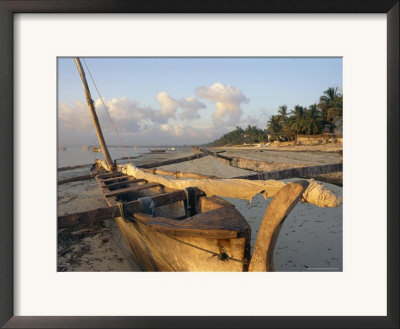 Canoe Pulled Up Onto Beach At Dusk, Bamburi Beach, Near Mombasa, Kenya, Africa by Charles Bowman Pricing Limited Edition Print image