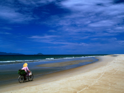 Cycling Along Cua Dai Beachfront, Hoi An, Quang Nam, Vietnam by Bernard Napthine Pricing Limited Edition Print image