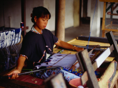 Woman Weaving On Traditional Loom In Workshop, Lombok, Indonesia by Richard I'anson Pricing Limited Edition Print image