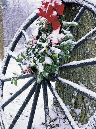 Wagon Wheel And Evergreen Swag With Red Bow by Kathy Heister Pricing Limited Edition Print image