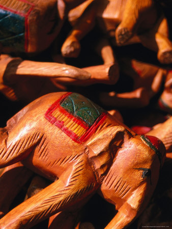 Wooden Elephants For Sale At Chatuchak Weekend Market, Bangkok, Thailand by Juliet Coombe Pricing Limited Edition Print image