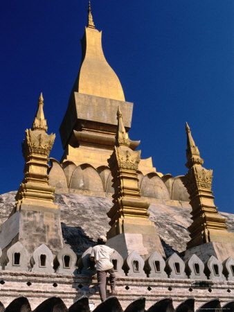 Man Clambering On Pha That Luang (Great Sacred Reliquary Or Great Stupa), Vientiane, Laos by Bernard Napthine Pricing Limited Edition Print image