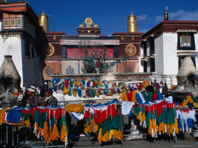 Colourful Prayer Flags In Square Outside Traditional Building, Lhasa, Tibet by Bill Wassman Pricing Limited Edition Print image