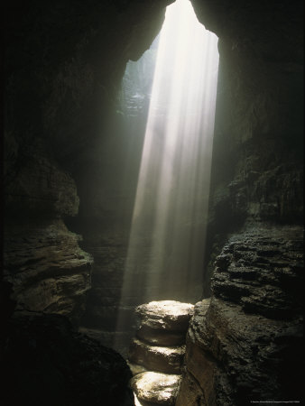 Beam Of Sunlight Shines On A Rock Pedestal In A Cave by Stephen Alvarez Pricing Limited Edition Print image