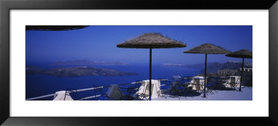 Table And Chairs On A Balcony, Santo Winery, Fira, Oia, Santorini, Greece by Panoramic Images Pricing Limited Edition Print image
