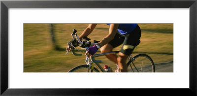 Woman Cycling by Panoramic Images Pricing Limited Edition Print image