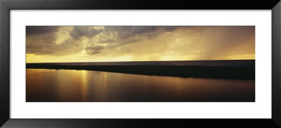 Clouds Over A River At Sunset, Platte River, Lake Michigan, Michigan, Usa by Panoramic Images Pricing Limited Edition Print image