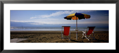 Two Empty Chairs Under A Beach Umbrella, Lignano Sabbiadoro, Italy by Panoramic Images Pricing Limited Edition Print image
