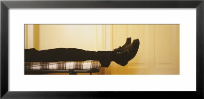 Low Section View Of A Man Lying On The Bed, Germany by Panoramic Images Pricing Limited Edition Print image