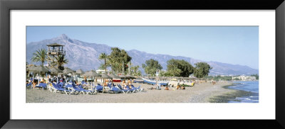 Tourists On The Beach, San Pedro, Costa Del Sol, Marbella, Andalusia, Spain by Panoramic Images Pricing Limited Edition Print image