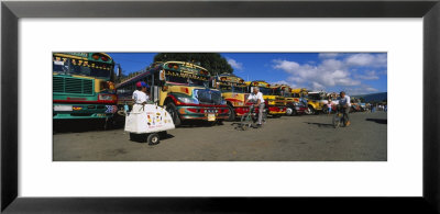 Buses Standing In A Row At A Bus Station, Antigua, Guatemala by Panoramic Images Pricing Limited Edition Print image