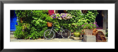 Bicycle In Front Of Wall Covered With Plants And Flowers, Rochefort En Terre, France by Panoramic Images Pricing Limited Edition Print image