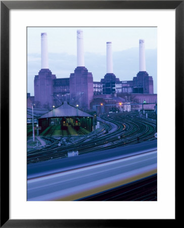Rail Tracks Heading Towards Victoria Station With Battersea Power Station In Background, England by Brigitte Bott Pricing Limited Edition Print image