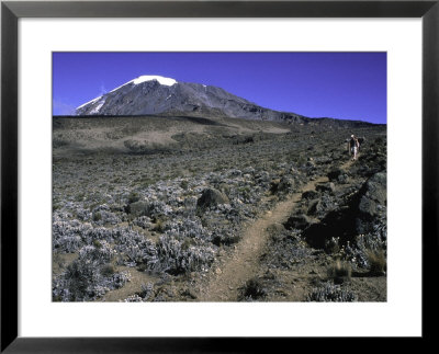Hikers Moving Through A Rocky Area, Kilimanjaro by Michael Brown Pricing Limited Edition Print image
