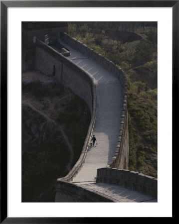 An Elevated View Of A Person Walking Along The Great Wall Of China by Jodi Cobb Pricing Limited Edition Print image