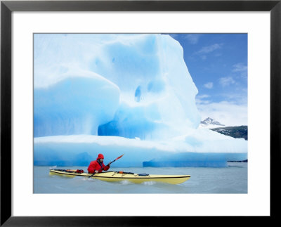 Person Kayaking Near Floating Icebergs, Lago Gray, Torres Del Paine National Park, Patagonia by Marco Simoni Pricing Limited Edition Print image