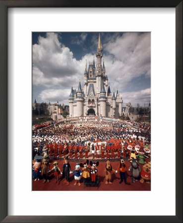 Walt Disney Characters And Park Staff Posing En Masse In Front Of Cinderella's Castle by Yale Joel Pricing Limited Edition Print image