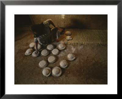 An Egyptian Woman Makes Loaves Of Bread In A Traditional Manner by Kenneth Garrett Pricing Limited Edition Print image