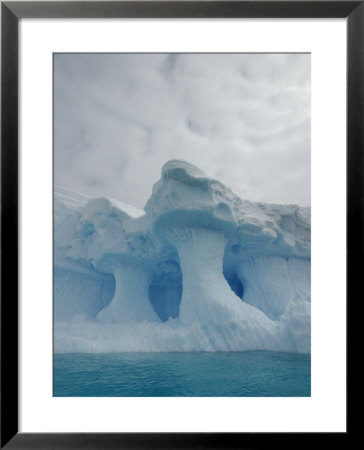 A Sculpted Iceberg Under A Fully Clouded Sky by Ralph Lee Hopkins Pricing Limited Edition Print image