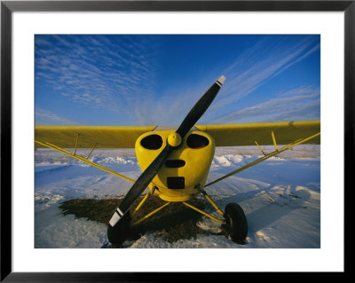 A Small Personal Aircraft Sitting In A Snowy Field by Heather Perry Pricing Limited Edition Print image