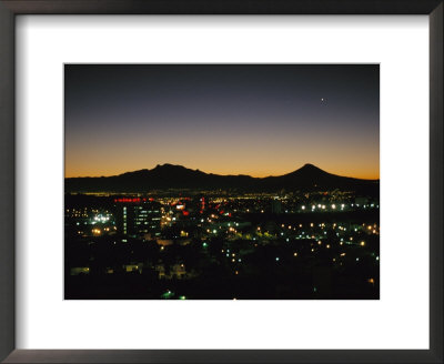 A Night View Of Sprawling Mexico City And Nearby Mountains by Raul Touzon Pricing Limited Edition Print image