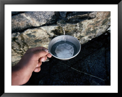 Hiker Getting A Cool Cup Of Water by Sam Abell Pricing Limited Edition Print image