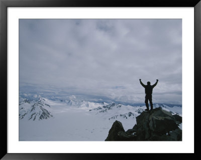 A Climber Raises His Arms In Triumph After Climbing Aurora Peak by John Burcham Pricing Limited Edition Print image