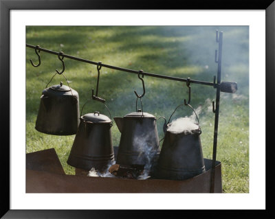 Four Metal Coffee Pots Steaming Over An Outdoor Grill by Michael S. Lewis Pricing Limited Edition Print image