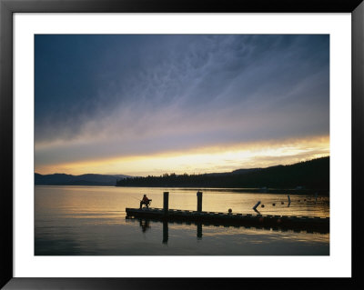 A Fisherman At Dawn Tries His Luck From The End Of A Pier by Michael S. Lewis Pricing Limited Edition Print image