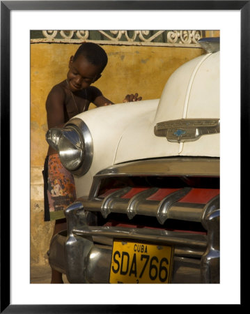 Young Boy Drumming On Old American Car's Bonnet,Trinidad, Sancti Spiritus Province, Cuba by Eitan Simanor Pricing Limited Edition Print image