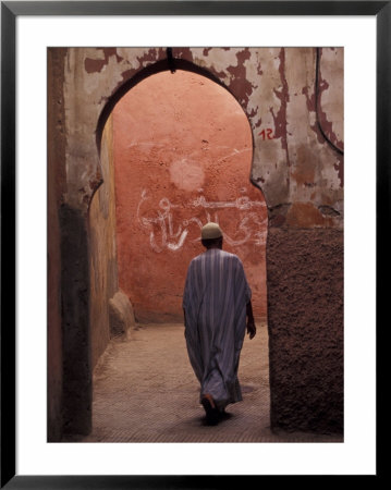 Man Walking Through Souq Arch, Marrakech, Morocco by Darrell Gulin Pricing Limited Edition Print image