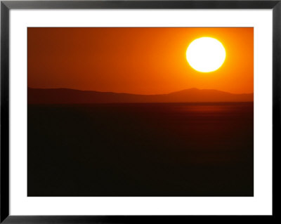 The Rising Sun Hovers Over Distant Mountains by James P. Blair Pricing Limited Edition Print image